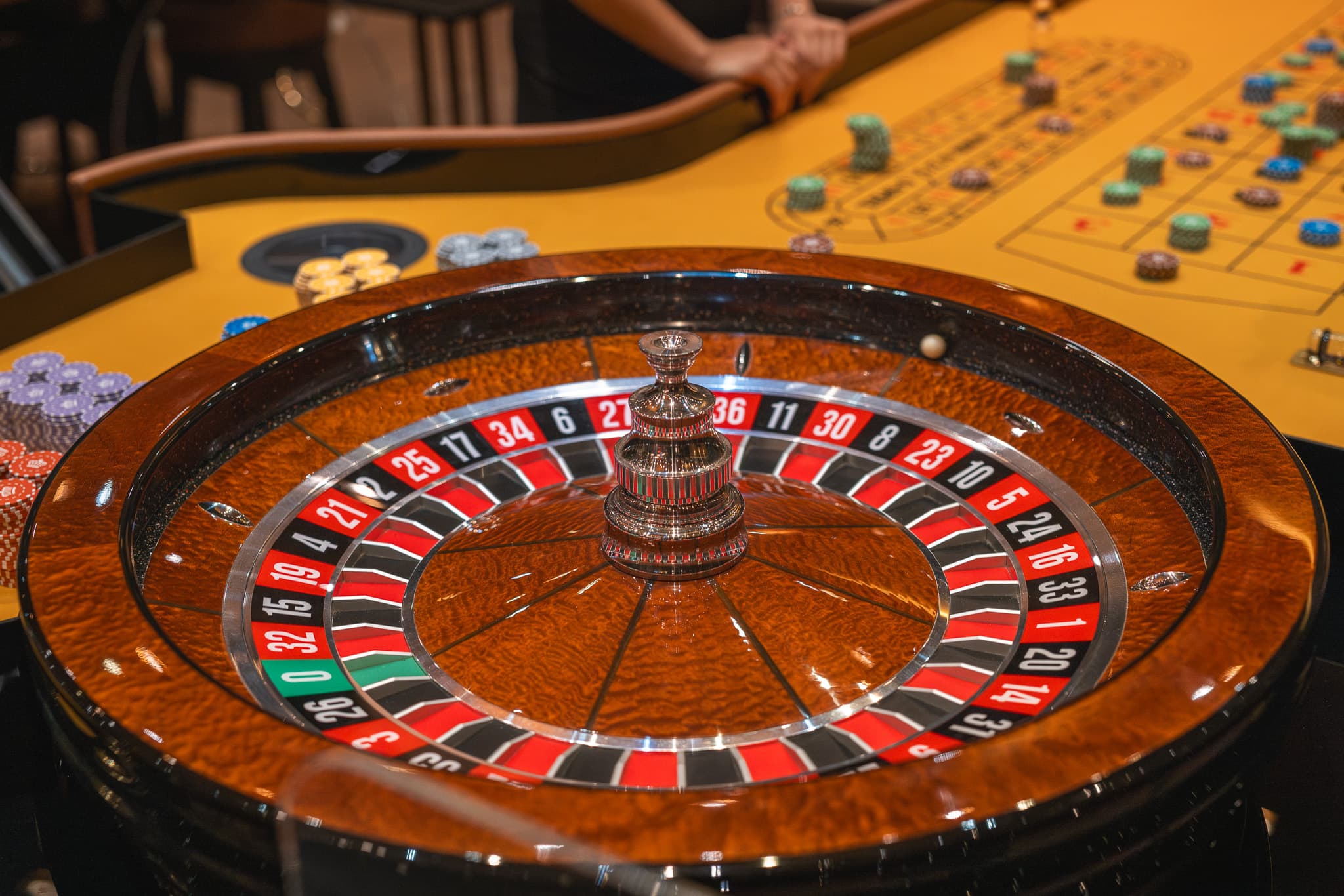 The burl-wood roulette wheel and gold-felt table at Gamers Casino in central Prague — a welcoming, beginner-friendly place to try roulette for the first time